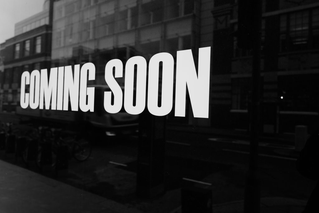 image of white lettering on black background with text of "Coming Soon"